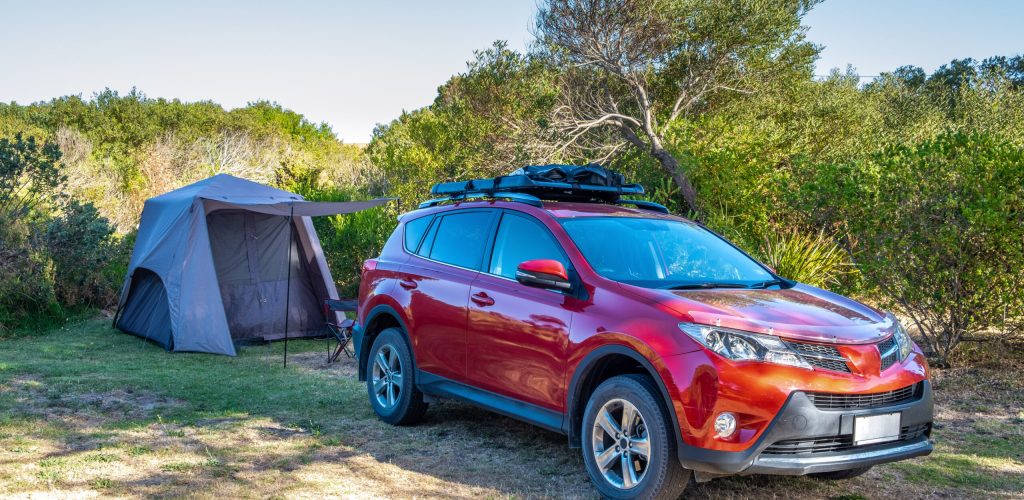 SUV car and pitched tent at a holiday park in Australia