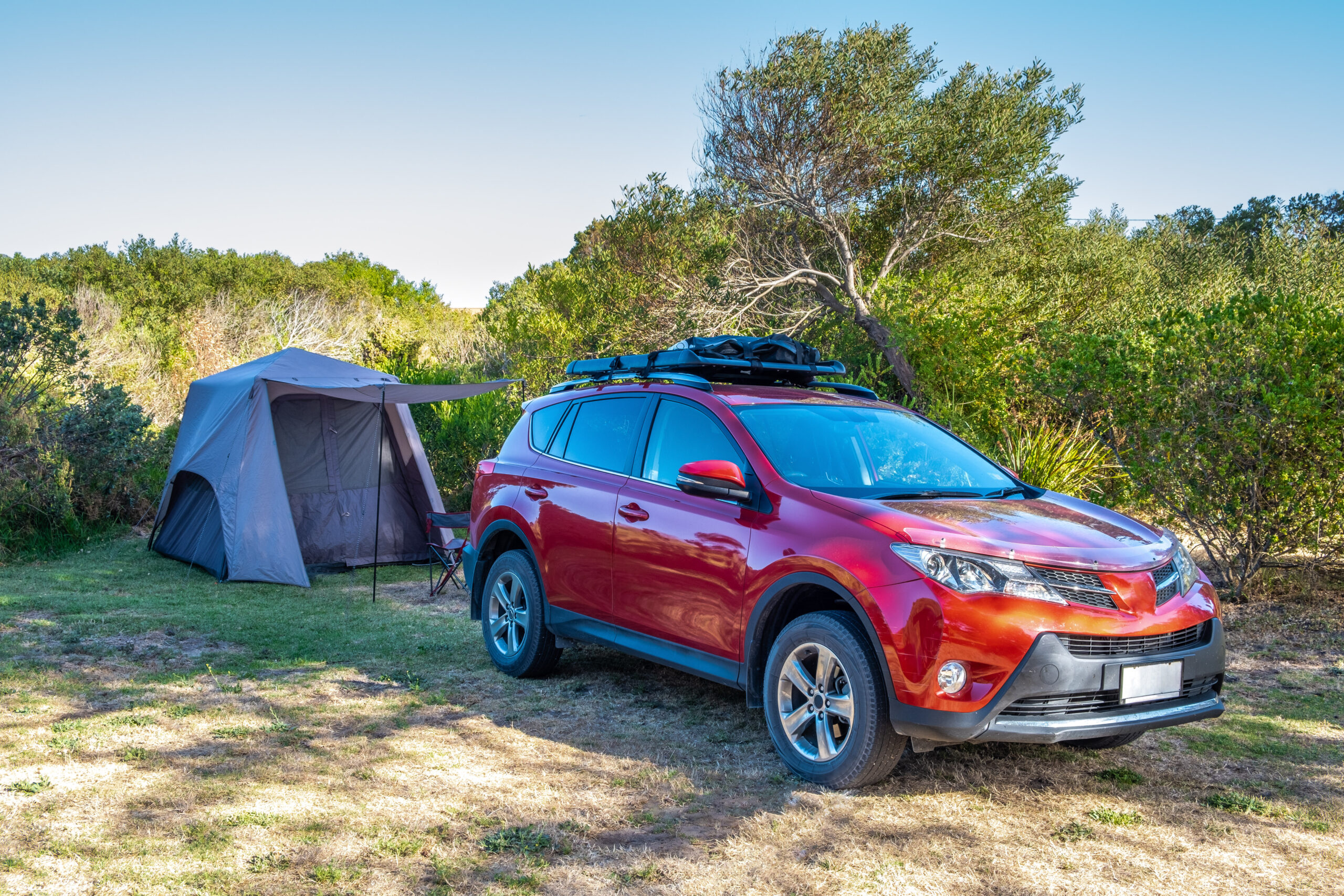 SUV car and pitched tent at a holiday park in Australia